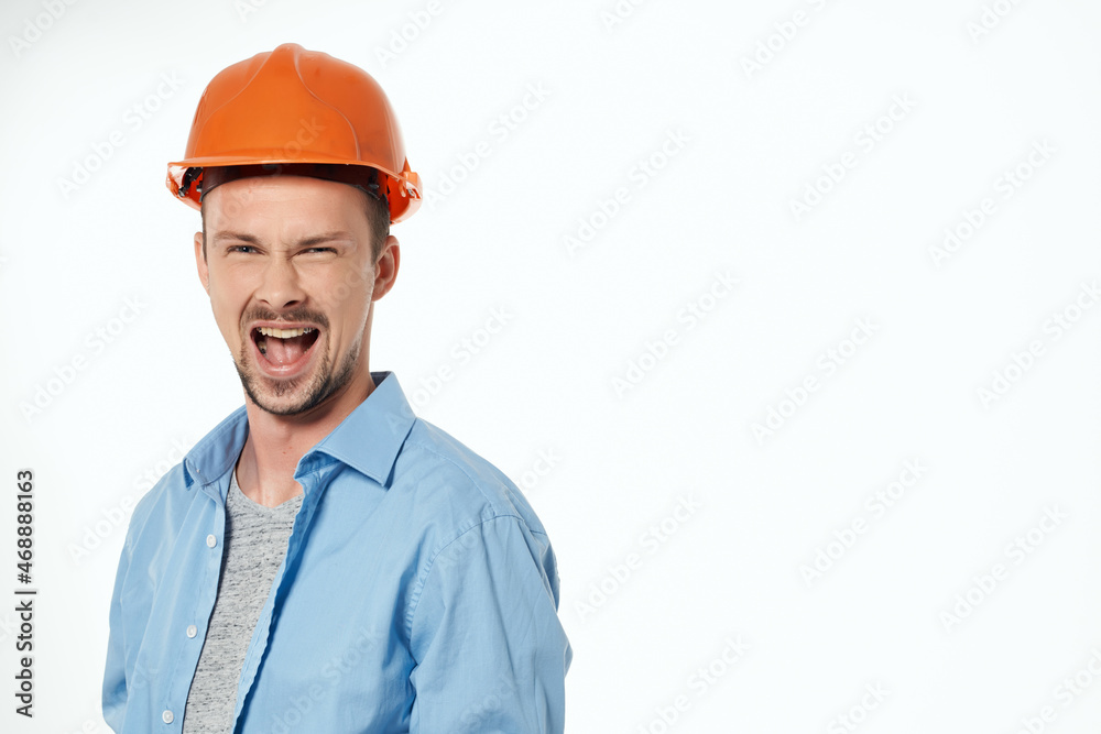 man in orange helmet protection isolated background man in orange helmet protection isolated background