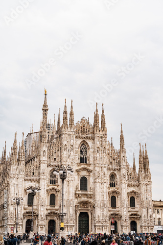 View of the marble facade of the Duomo Cathedral. Italy, Milan © Nadtochiy