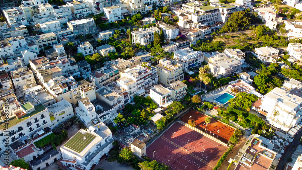 Aerial view of Capri homes and cityscape at summer sunset, Campania - Italy