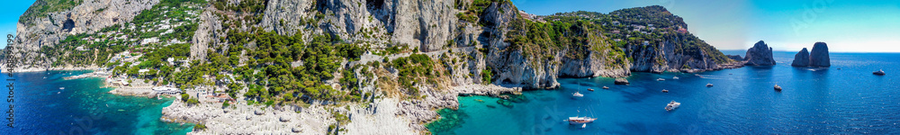 Faraglioni from Marina Piccola Beach in Capri, Italy. Aerial view from drone.