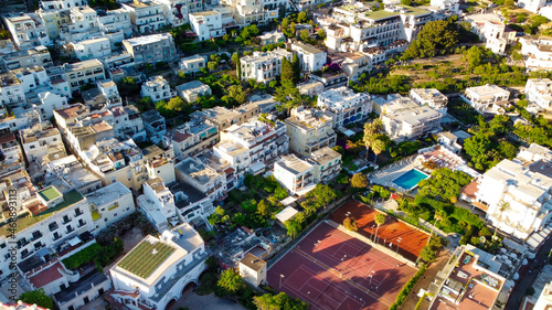 Aerial view of Capri homes and cityscape at summer sunset, Campania - Italy