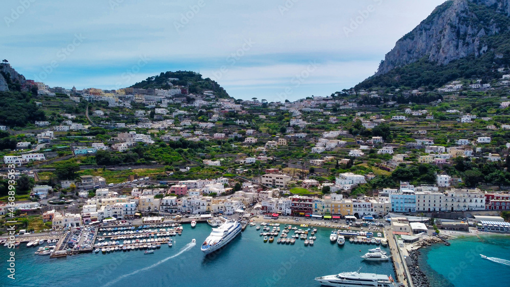 Beautiful coastline of Capri along the port area. Aerial view from drone.