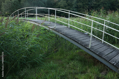 A bridge over a creek for pedestrians at estate De Haere near Deventer, the Netherlands 