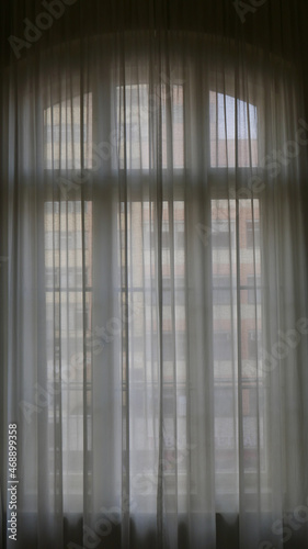 Wallpaper Mural light shining through large window, distant windows can be seen through curtains Torontodigital.ca