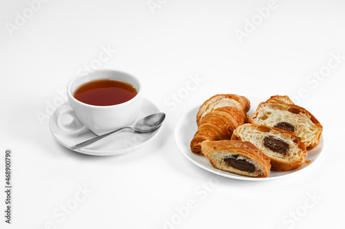 morning tea party. English Afternoon Tea. tea with croissants. light snack between meals. croissant with chocolate on a white background