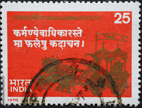 India - circa 1978: a postage stamp from India showing a carriage with horses for the occasion of "Bhagswad geeta" (Divine Song of India) Commemoration