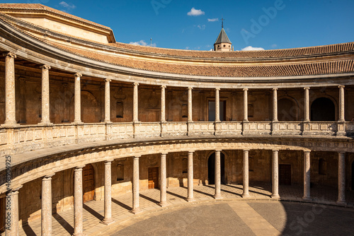 The unique circular patio of the Palace of Charles V (Palacio de Carlos V) with its two levels of columns in form of Doric and Ionic colonnades, Alhambra de Granada, Andalusia, Spain photo