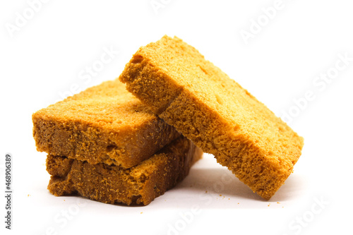 Crispy rusk on white background with selective focus photo