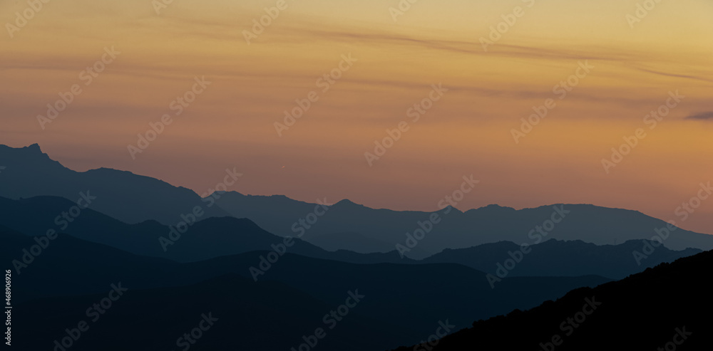 sunset over the corsican mountains near saint florent ,corsica France , soft layered misty colours ,with copy space .