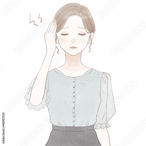 頭痛に悩まされる女性