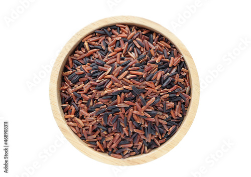 Red rice (Lady ruby grain) and Black jasmine rice in a wooden bowl on white background. Clipping path