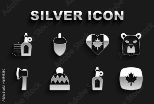 Set Beanie hat, Beaver animal, Canadian maple leaf, Bottle of syrup, Wooden axe, Heart shaped Canada flag, Syrup with pancakes and Acorn icon. Vector