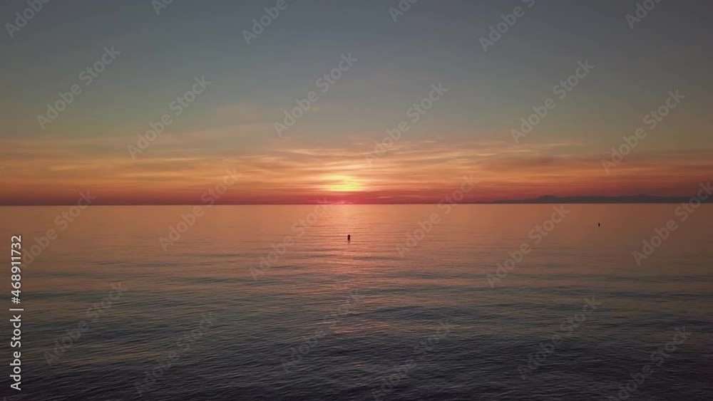shooting in flight sunset on the sea. evening sky over the water.