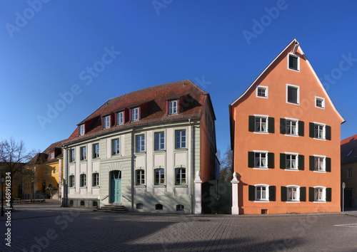 City square with a baroque school building and the gable facade of a residential house in the old town of Herrieden, Franken region in Germany