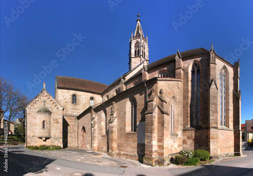 Panoramic view of the medieval monastery church with its ridge turret and its gothic apse in Heilsbronn, Franken region in Germany photo