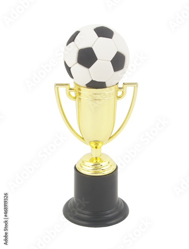 Soccer ball on golden trophy cup isolated on white background. Football championship concept.