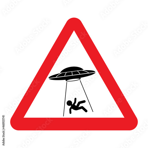 UFO abducts human from earth. Vector illustration of red triangle warning road sign with alien abducts man. Humorous traffic sign. Caution alien invasion in unidentified spaceship.