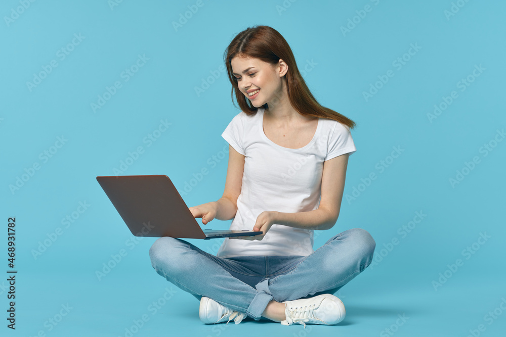 woman with laptop learning internet online education blue background woman with laptop learning internet online education blue background