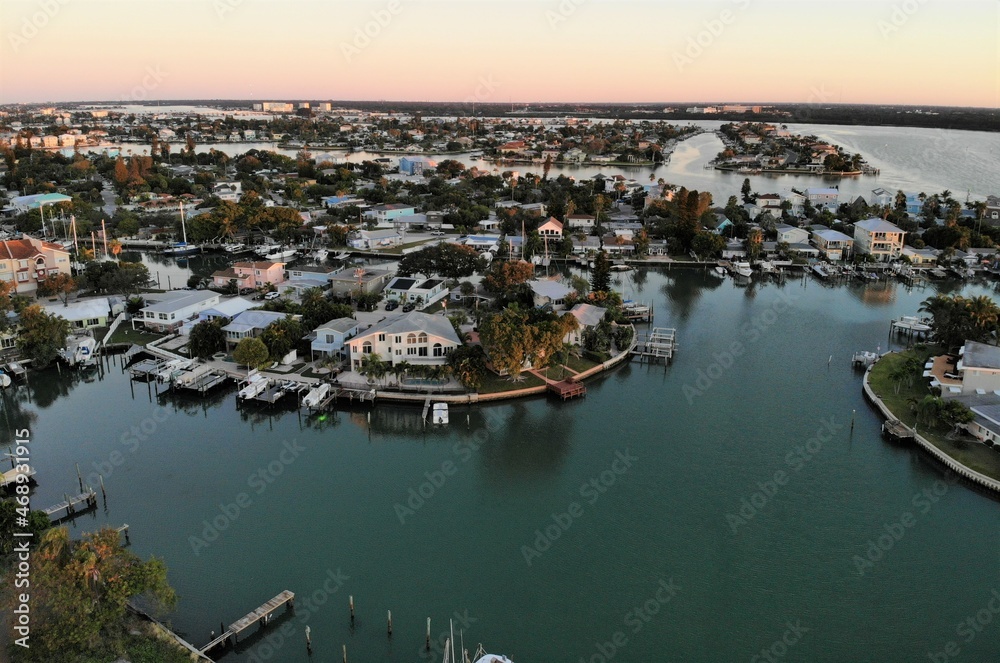 The aerial view of the waterfront homes during early morning near John Pass, Madeira Beach, Florida, U.S.A