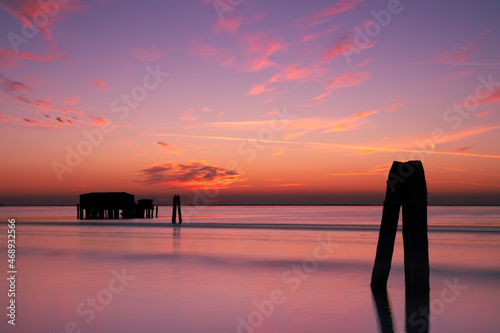 Sunset on the Venetian lagoon with the  fishermen's houses, Pellestrina island, Venetian lagoon, Italy