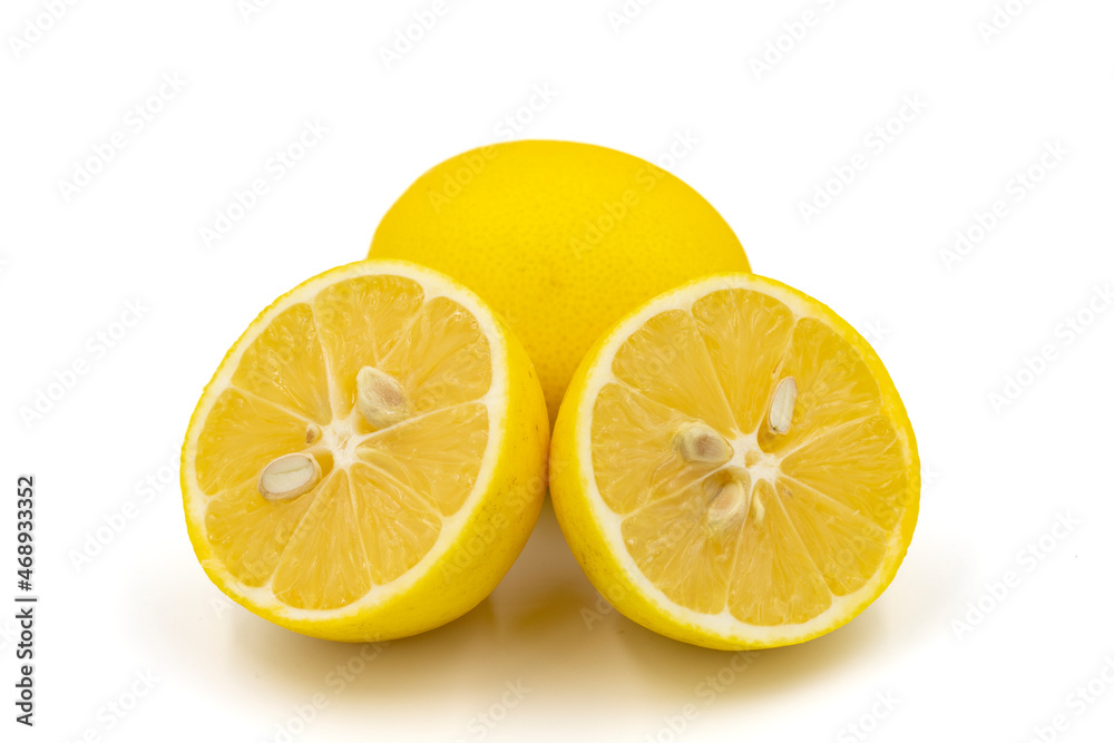 Organic lemon on a white background. Close-up of lemon cut in half
