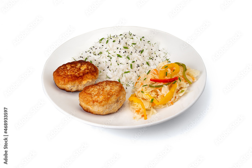 Сlose up Homemade fried Fish Or Chicken Cutlets with rice and salad with sauerkraut on white plate isolated. Gourmet, portion. Banner menu recipe.