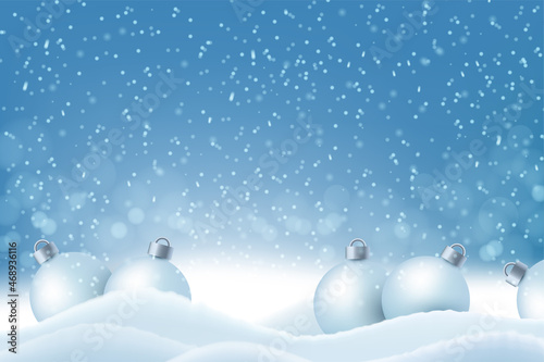Christmas balls on the snow on a blue background © EcodoDesign