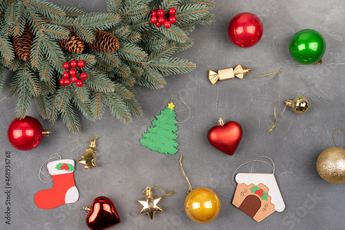 Green Christmas wreath with decorations and balls on gray concrete table background, Christmas celebrate concept