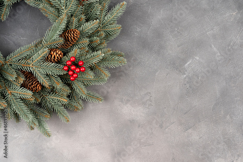 Christmas wreath of vines decorated with fir branches, Christmas natural materials, New Year concept