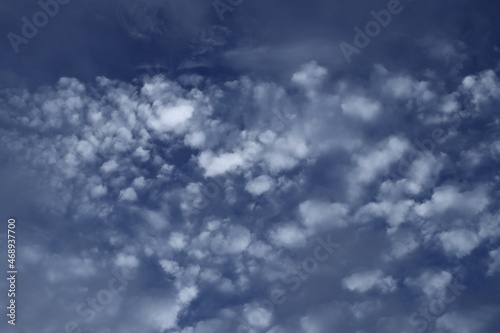 Beautiful white fluffy clouds on a deep blue sky