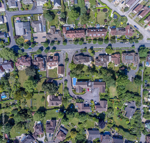 Aerial top down view of urban area urbanisation in local neighbourhood Drone bird eye view of streets and roofs from above in Andover, England, UK photo