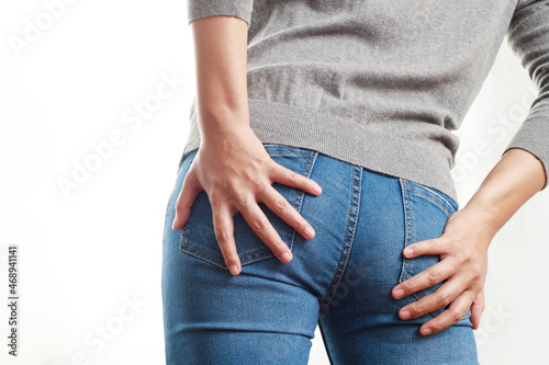 concept of health problems woman has hemorrhoids