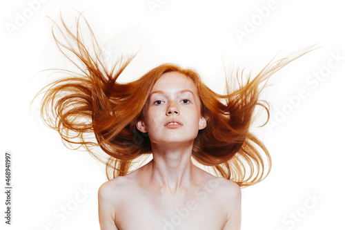 wide jaw of a red-haired girl with flowing hair isolated on a white background