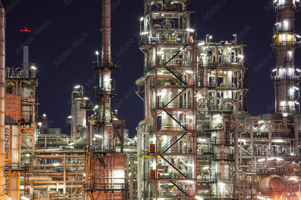 Oil​ refinery​ and​  plant and tower column of Petrochemistry industry in oil​ and​ gas​ ​industrial with​ cloud​ blue​ ​sky