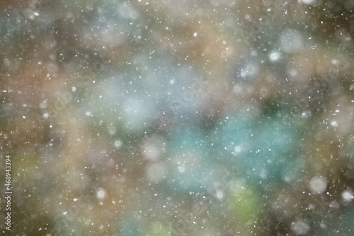 colorful background snow snowfall evening christmas lights, soft light blurry © kichigin19