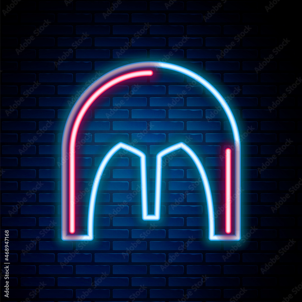 Glowing neon line Medieval iron helmet for head protection icon isolated on brick wall background. Colorful outline concept. Vector