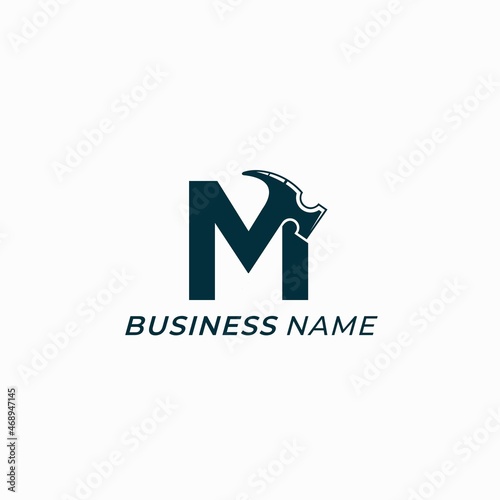 design logo creative letter M and hammer