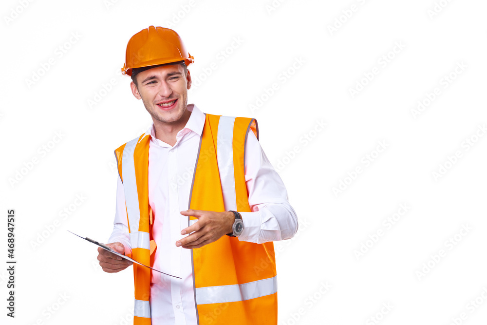 working man in orange uniform posing construction