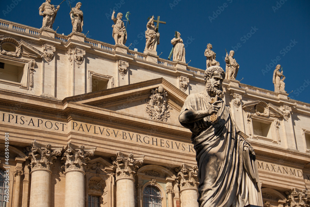 Statue of Saint Peter and Saint Peter's Basilica at background 