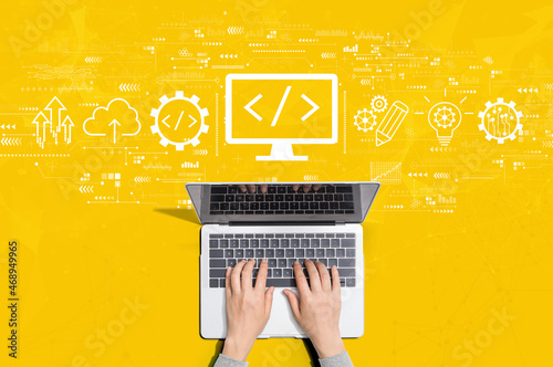 Fototapeta Web development concept with person using a laptop computer