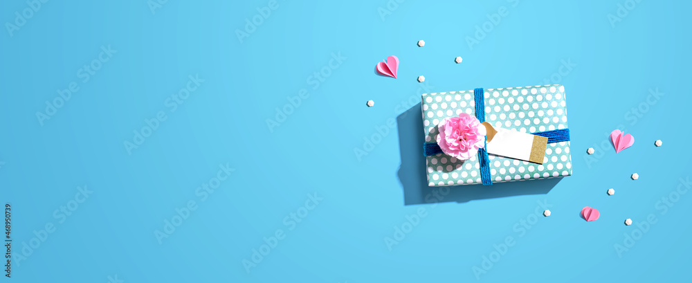 Appreciation theme with a gift box and a pink carnation flower