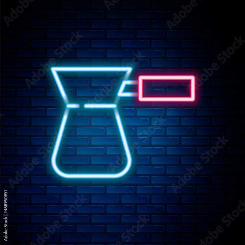 Glowing neon line Coffee turk icon isolated on brick wall background. Colorful outline concept. Vector