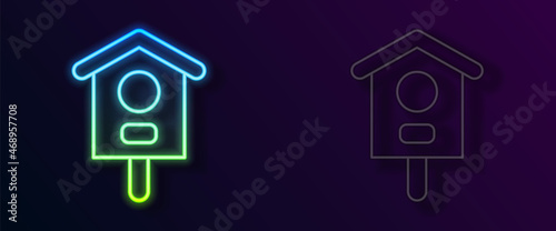 Glowing neon line Bird house icon isolated on black background. Nesting box birdhouse, homemade building for birds. Vector