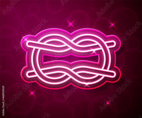Glowing neon line Nautical rope knots icon isolated on red background. Rope tied in a knot. Vector