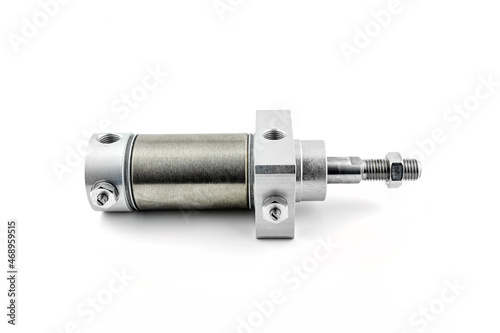 Closeup photo of a pneumatic air cylinder with a thread and nut on the end, visible screw-in air damper, isolated on a white background.