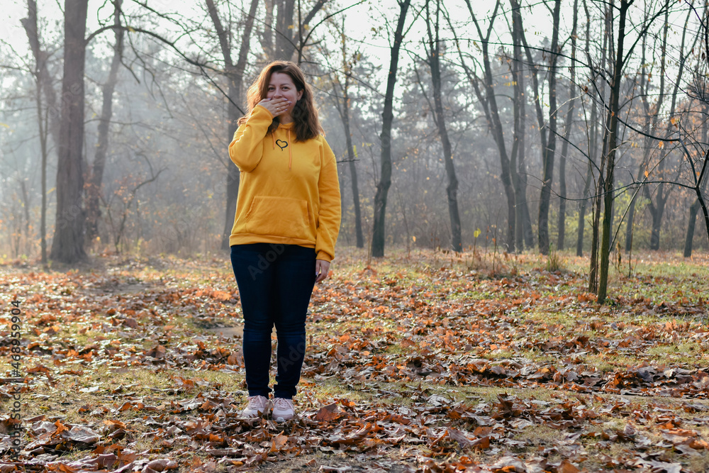 woman walking in autumn park woman walking in autumn park