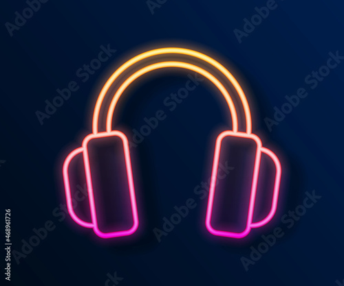 Glowing neon line Headphones icon isolated on black background. Earphones. Concept for listening to music, service, communication and operator. Vector