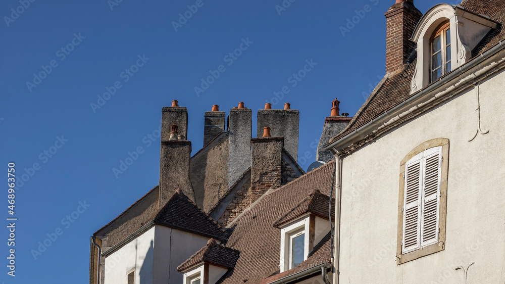 Multiple chimneys the roof tops of a french town Multiple chimneys the roof tops of a french town