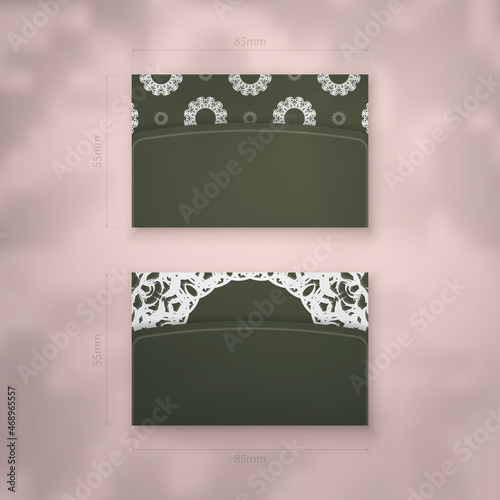 A presentable business card in dark green with an old white pattern for your contacts.