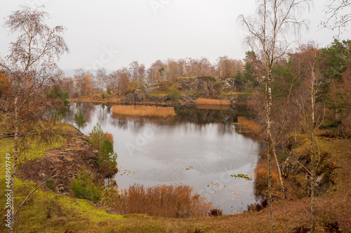 Autumn colors at Svanshall quarry lake close to a small fishing village in the southwest Sweden.